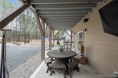 This stunning mountain farmhouse blends rustic charm with modern on Upland Trace Golf Course in North Carolina - for sale on GolfHomes.com, golf home, golf lot