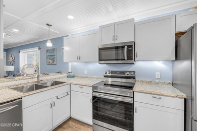 UPDATED. GOLF NEXT DOOR. MINUTES TO THE BEACH. This 2-bed on Holiday Golf Club in Florida - for sale on GolfHomes.com, golf home, golf lot