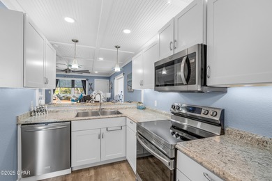 UPDATED. GOLF NEXT DOOR. MINUTES TO THE BEACH. This 2-bed on Holiday Golf Club in Florida - for sale on GolfHomes.com, golf home, golf lot