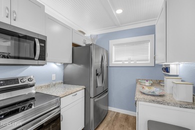 UPDATED. GOLF NEXT DOOR. MINUTES TO THE BEACH. This 2-bed on Holiday Golf Club in Florida - for sale on GolfHomes.com, golf home, golf lot