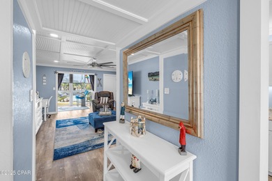 UPDATED. GOLF NEXT DOOR. MINUTES TO THE BEACH. This 2-bed on Holiday Golf Club in Florida - for sale on GolfHomes.com, golf home, golf lot