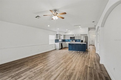 Welcome to this stunning home in the 55+ community of Tampa Bay on Tampa Bay Golf and Country Club in Florida - for sale on GolfHomes.com, golf home, golf lot