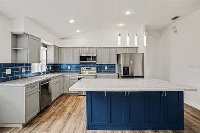 Welcome to this stunning home in the 55+ community of Tampa Bay on Tampa Bay Golf and Country Club in Florida - for sale on GolfHomes.com, golf home, golf lot