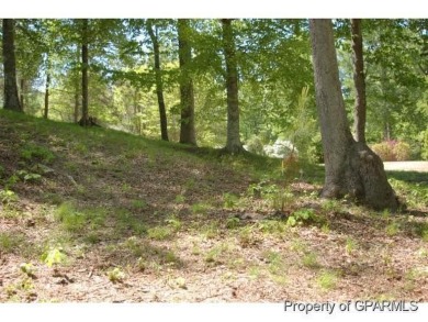 Build your dream house on this beautiful, hilly lot overlooking on Ironwood Golf and Country Club in North Carolina - for sale on GolfHomes.com, golf home, golf lot