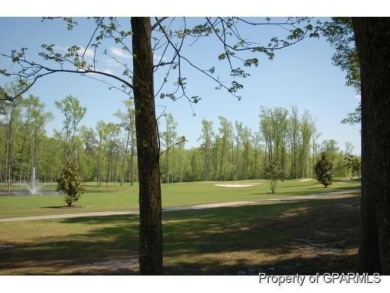 Build your dream house on this beautiful, hilly lot overlooking on Ironwood Golf and Country Club in North Carolina - for sale on GolfHomes.com, golf home, golf lot