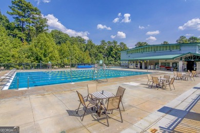 THIS STUNNING OPEN RANCH PLAN IS CONVENIENTLY LOCATED IN NORTH on Canongate At Flat Creek Club in Georgia - for sale on GolfHomes.com, golf home, golf lot