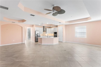 GOLF CART INCLUDED & SELLER OFFERING PAINTING CONCESSION - on Panther Run Golf Club in Florida - for sale on GolfHomes.com, golf home, golf lot