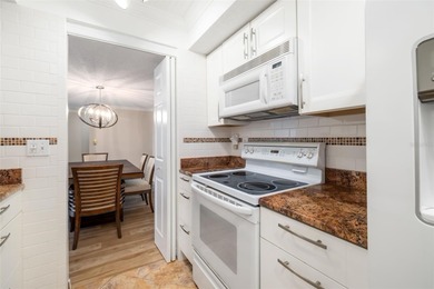 Step inside this beautifully remodeled 3rd-floor, 2-bedroom on IMG Academies Golf and Country Club in Florida - for sale on GolfHomes.com, golf home, golf lot