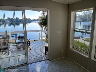 Direct waterfront manufactured home (2005) offering panoramic on The Club at Emerald Hills in Florida - for sale on GolfHomes.com, golf home, golf lot