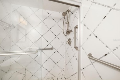 Step inside this beautifully remodeled 3rd-floor, 2-bedroom on IMG Academies Golf and Country Club in Florida - for sale on GolfHomes.com, golf home, golf lot