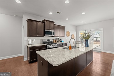 Like-new and show-stopping, this extremely well-kept home looks on The Frog Golf Club in Georgia - for sale on GolfHomes.com, golf home, golf lot