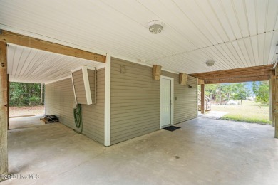 Sought after Davis Canal Front Property featuring boat lift on Founders Club At St. James Plantation in North Carolina - for sale on GolfHomes.com, golf home, golf lot
