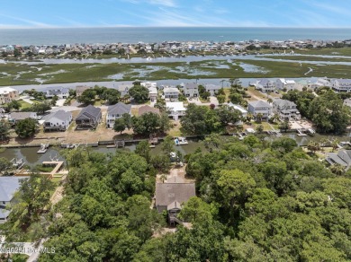 Sought after Davis Canal Front Property featuring boat lift on Founders Club At St. James Plantation in North Carolina - for sale on GolfHomes.com, golf home, golf lot