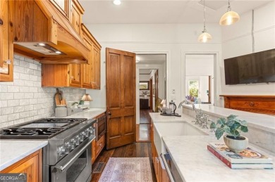 Step into a world of timeless luxury in the heart of Candler on Candler Park Golf Course in Georgia - for sale on GolfHomes.com, golf home, golf lot