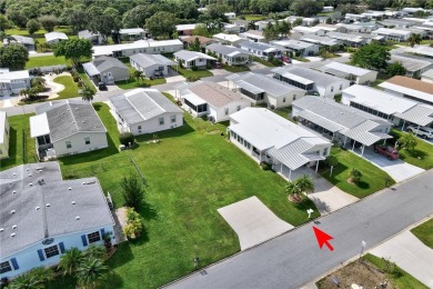 RARE OPPORTUNITY to own this gently used home on TWO LOTS on Barefoot Bay Golf Course in Florida - for sale on GolfHomes.com, golf home, golf lot