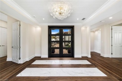 Step into luxury with this beautifully renovated waterfront home on Miromar Lakes Golf Club in Florida - for sale on GolfHomes.com, golf home, golf lot