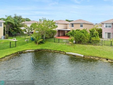 Spectacular LAKE VIEWS from this 4 bedroom 2.5 bath home located on Inverrary Country Club in Florida - for sale on GolfHomes.com, golf home, golf lot