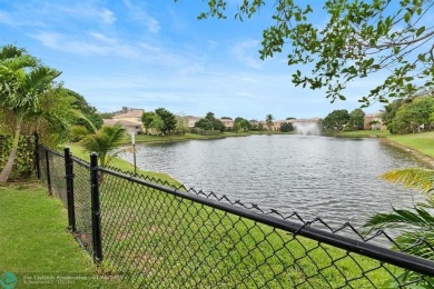 Spectacular LAKE VIEWS from this 4 bedroom 2.5 bath home located on Inverrary Country Club in Florida - for sale on GolfHomes.com, golf home, golf lot