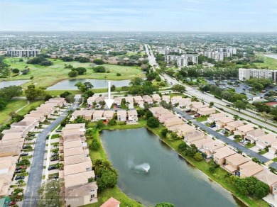 Spectacular LAKE VIEWS from this 4 bedroom 2.5 bath home located on Inverrary Country Club in Florida - for sale on GolfHomes.com, golf home, golf lot