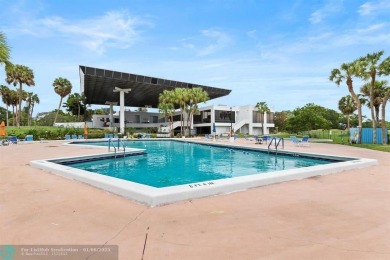 Spectacular LAKE VIEWS from this 4 bedroom 2.5 bath home located on Inverrary Country Club in Florida - for sale on GolfHomes.com, golf home, golf lot