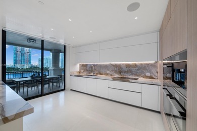 This elegantly designed 4-bedroom, 4.5-bath residence at Palazzo on Fisher Island Club in Florida - for sale on GolfHomes.com, golf home, golf lot