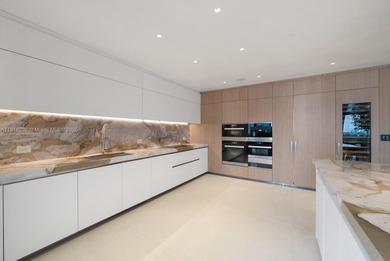 This elegantly designed 4-bedroom, 4.5-bath residence at Palazzo on Fisher Island Club in Florida - for sale on GolfHomes.com, golf home, golf lot