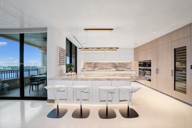 This elegantly designed 4-bedroom, 4.5-bath residence at Palazzo on Fisher Island Club in Florida - for sale on GolfHomes.com, golf home, golf lot