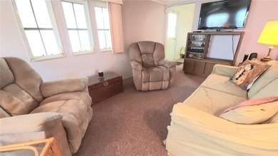 TWO BEDROOM, 1 1/2 BATHROOM MOBILE HOME IN ACTIVE 55+ COMMUNITY on River Run Golf Links in Florida - for sale on GolfHomes.com, golf home, golf lot