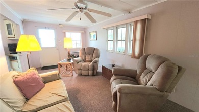 TWO BEDROOM, 1 1/2 BATHROOM MOBILE HOME IN ACTIVE 55+ COMMUNITY on River Run Golf Links in Florida - for sale on GolfHomes.com, golf home, golf lot