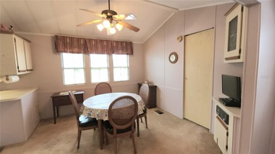 TWO BEDROOM, 1 1/2 BATHROOM MOBILE HOME IN ACTIVE 55+ COMMUNITY on River Run Golf Links in Florida - for sale on GolfHomes.com, golf home, golf lot