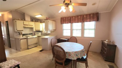 TWO BEDROOM, 1 1/2 BATHROOM MOBILE HOME IN ACTIVE 55+ COMMUNITY on River Run Golf Links in Florida - for sale on GolfHomes.com, golf home, golf lot