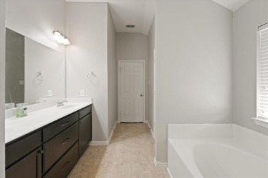 Beautifully designed one-story home offering 3 bedrooms, 2 on Woodbridge Golf Club in Texas - for sale on GolfHomes.com, golf home, golf lot