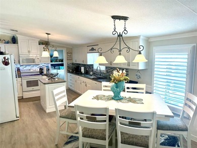 Step into your very own tropical oasis! This backyard is on The Links of Spruce Creek in Florida - for sale on GolfHomes.com, golf home, golf lot