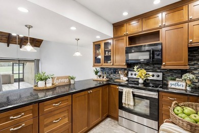 Turnkey Twin Lakes townhome with breathtaking views from BOTH on Carrollwood Country Club in Florida - for sale on GolfHomes.com, golf home, golf lot