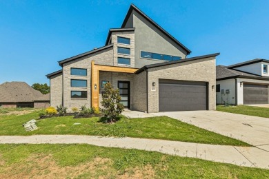 Welcome to 1412 Morris Crossing, a stunning modern home located on Heath Golf and Yacht Club in Texas - for sale on GolfHomes.com, golf home, golf lot