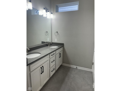 Discover the perfect blend of timeless charm and modern comfort on The Fort Golf Course in Indiana - for sale on GolfHomes.com, golf home, golf lot
