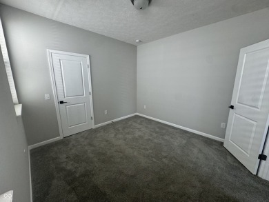 Discover the perfect blend of timeless charm and modern comfort on The Fort Golf Course in Indiana - for sale on GolfHomes.com, golf home, golf lot