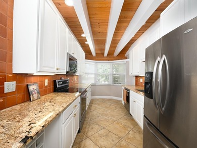 This exceptional lakefront gem is a nearly 2,000-square-foot on Gulf Gate Golf Club in Florida - for sale on GolfHomes.com, golf home, golf lot