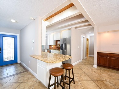 This exceptional lakefront gem is a nearly 2,000-square-foot on Gulf Gate Golf Club in Florida - for sale on GolfHomes.com, golf home, golf lot