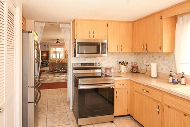 Immaculate second floor end unit in the beautiful Eagleswood on Beacon Woods Golf Club in Florida - for sale on GolfHomes.com, golf home, golf lot