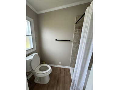 This is a newly remodeled mobile home in Horseshoe Bend Air Park on Horseshoe Bend Country Club in Texas - for sale on GolfHomes.com, golf home, golf lot