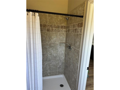 This is a newly remodeled mobile home in Horseshoe Bend Air Park on Horseshoe Bend Country Club in Texas - for sale on GolfHomes.com, golf home, golf lot