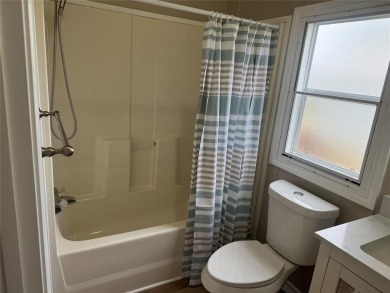 This is a newly remodeled mobile home in Horseshoe Bend Air Park on Horseshoe Bend Country Club in Texas - for sale on GolfHomes.com, golf home, golf lot