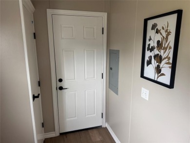 This is a newly remodeled mobile home in Horseshoe Bend Air Park on Horseshoe Bend Country Club in Texas - for sale on GolfHomes.com, golf home, golf lot