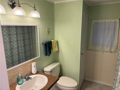 Move-in ready home in a desirable 55+ golf community overlooking on Zellwood Station Country Club in Florida - for sale on GolfHomes.com, golf home, golf lot