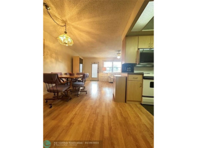 Welcome home to this RARE 1 bdrm, 2 full bath condo on the FIRST on Hillsboro Pines Golf in Florida - for sale on GolfHomes.com, golf home, golf lot