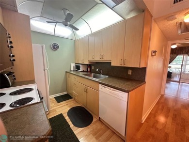 Welcome home to this RARE 1 bdrm, 2 full bath condo on the FIRST on Hillsboro Pines Golf in Florida - for sale on GolfHomes.com, golf home, golf lot
