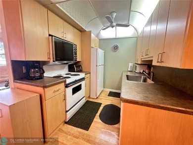 Welcome home to this RARE 1 bdrm, 2 full bath condo on the FIRST on Hillsboro Pines Golf in Florida - for sale on GolfHomes.com, golf home, golf lot
