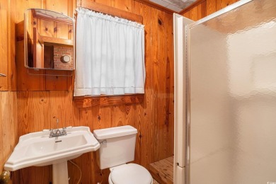 This charming 2-bedroom, 1-bath cottage with no HOA is located on Beachwood Golf Club in South Carolina - for sale on GolfHomes.com, golf home, golf lot