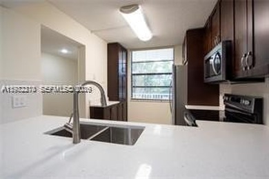 Wake up every morning to peaceful golf course views in one of on Pine Island Ridge Country Club in Florida - for sale on GolfHomes.com, golf home, golf lot